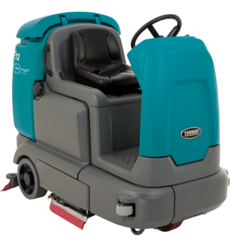 Compact battery-powered rider scrubber TENNANT T12